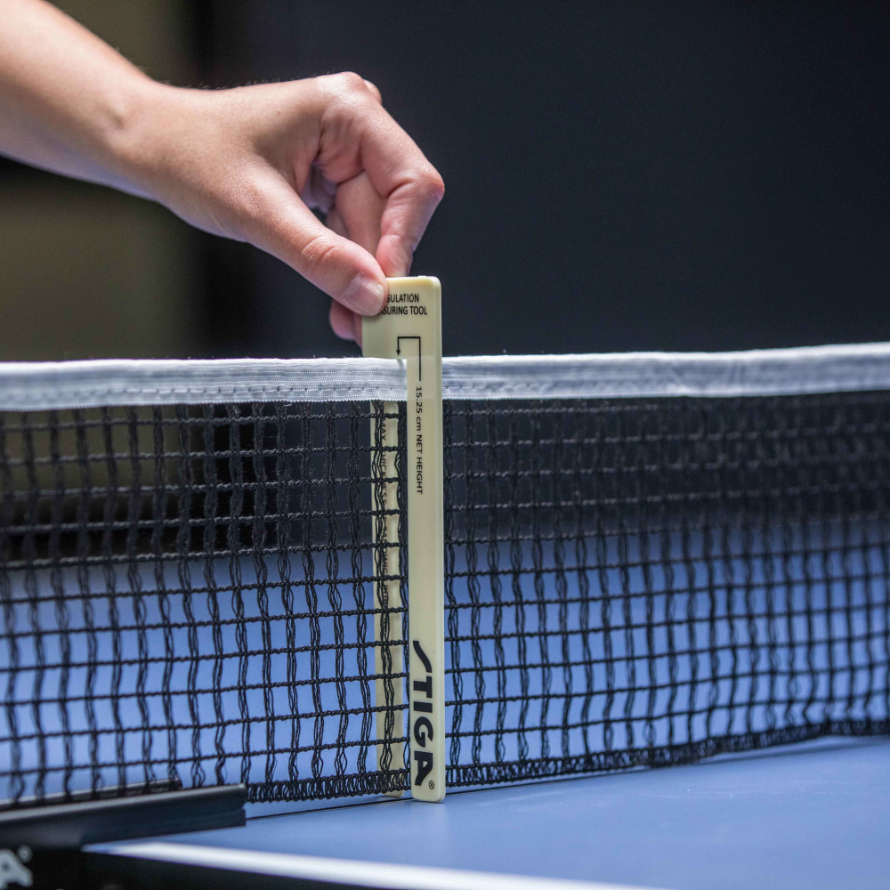 Adjusting a ping pong net to official requirements