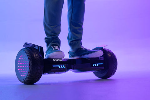 Child riding GOTRAX E5 Off-Road Bluetooth Hoverboard with Infinity Wheels