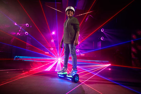 Child riding a GOTRAX Chrome Bluetooth Hoverboard with LEDs