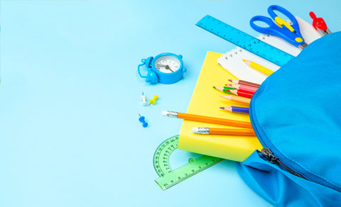 School bag. Backpack with supplies for school on blue background.