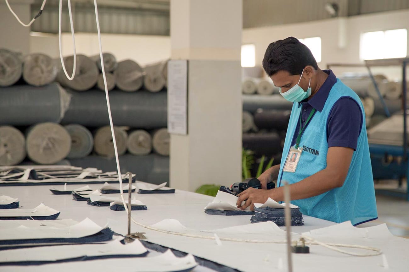 Cutting denim fabric at Chottani Industries