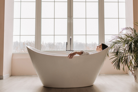 A woman relaxing in a bathtub