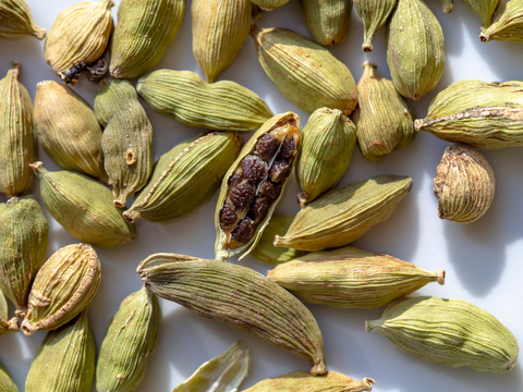 close up view of cardamom pods open