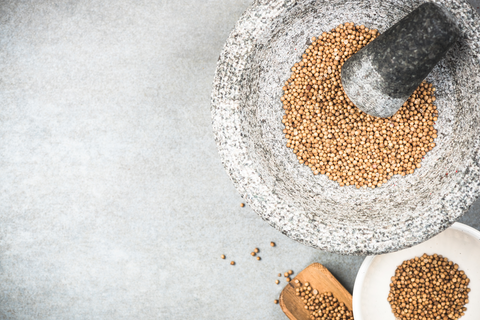 wheat berries in mortar and pestle