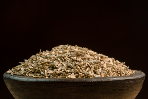 fennel seeds in a wooden bowl