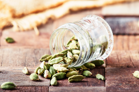 glass jar with cardamom pods inside