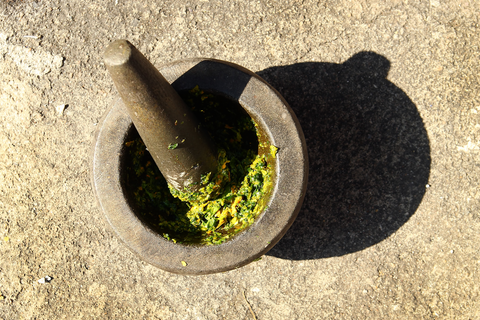 mortar and pestle with pesto inside