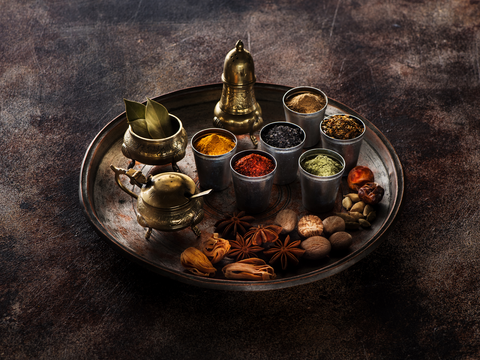 different spices displayed on a metal plate