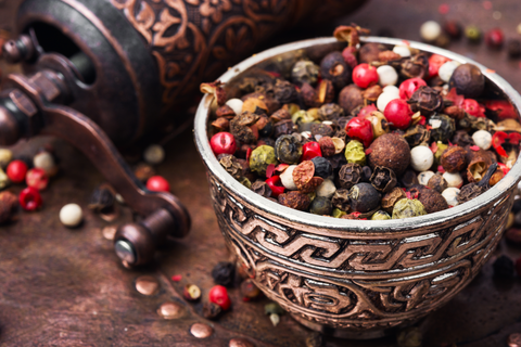 peppercorns placed in a metal bowl