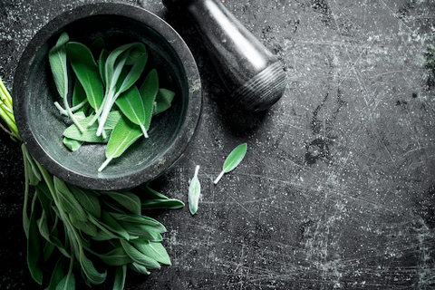 mortar and pestle with herbs