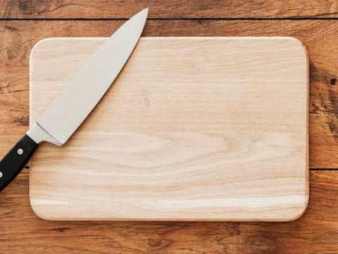 Wooden cutting board and knife