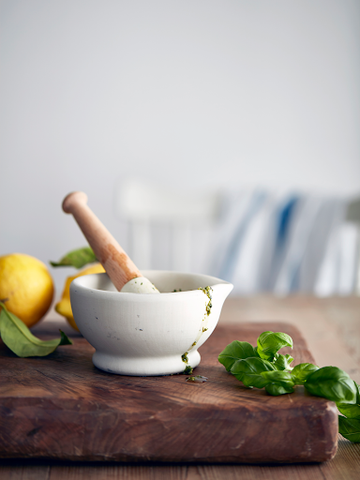 white and wood mortar and pestle