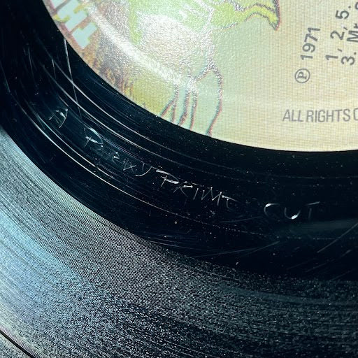 What do the etchings at the end of a record mean?