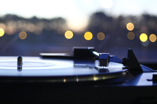 A record player showing a vinyl record being pla