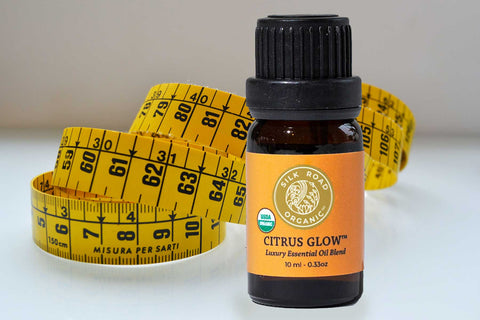 bottle of citrus glow with tape measure in the background