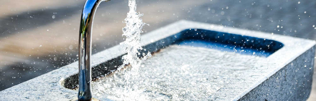 faucet spilling water into a basin