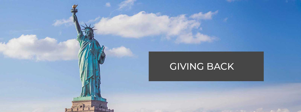 Giving Back Statue of Liberty background