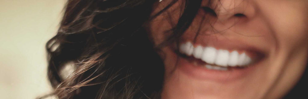 cropped to show woman's smile