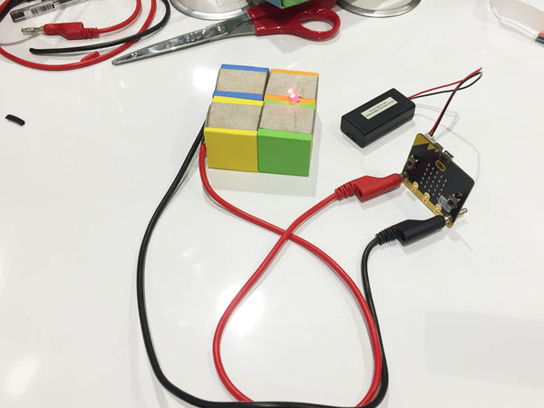 Microbit connected to banana plug and TapeBlock