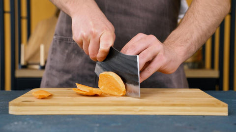 Slice the potato in half lengthwise. If you're making fries from a large sweet potato, slice it into quarters.