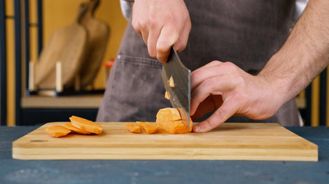 Stack both halves or quarters of the sweet potato together, then cut vertically into 14 inch equal-sized slices.