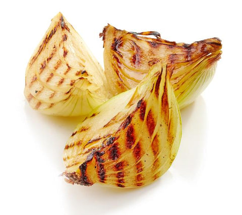 grilled onion quarters on white background