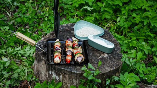 serve and enjoy the campfire grilled chicken skewer