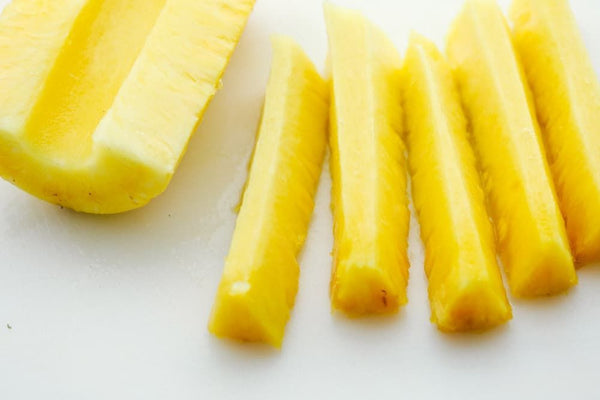 Cut pineapple into slices 
