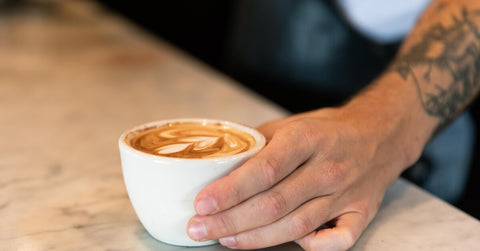 A person serving latte