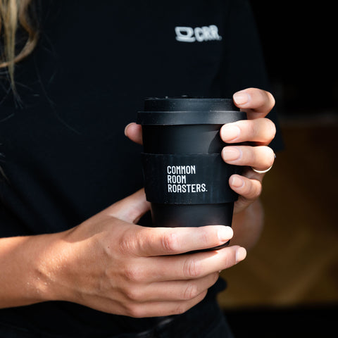 person holding e-coffee cup