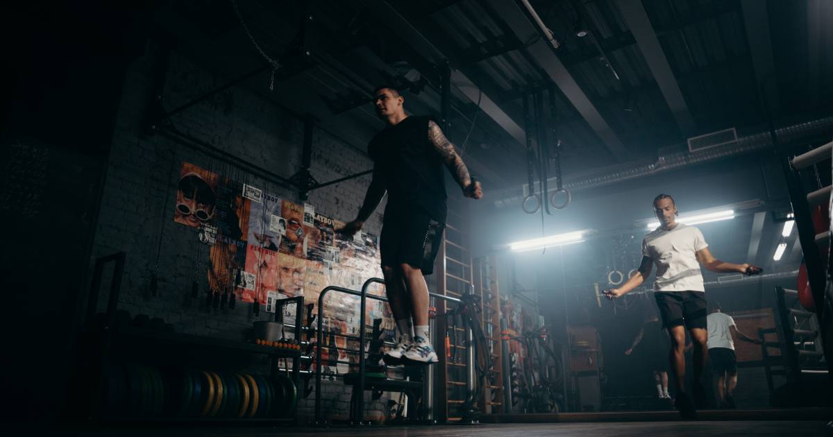 Men in gym jumping rope after eating military diet substitution beef snacks