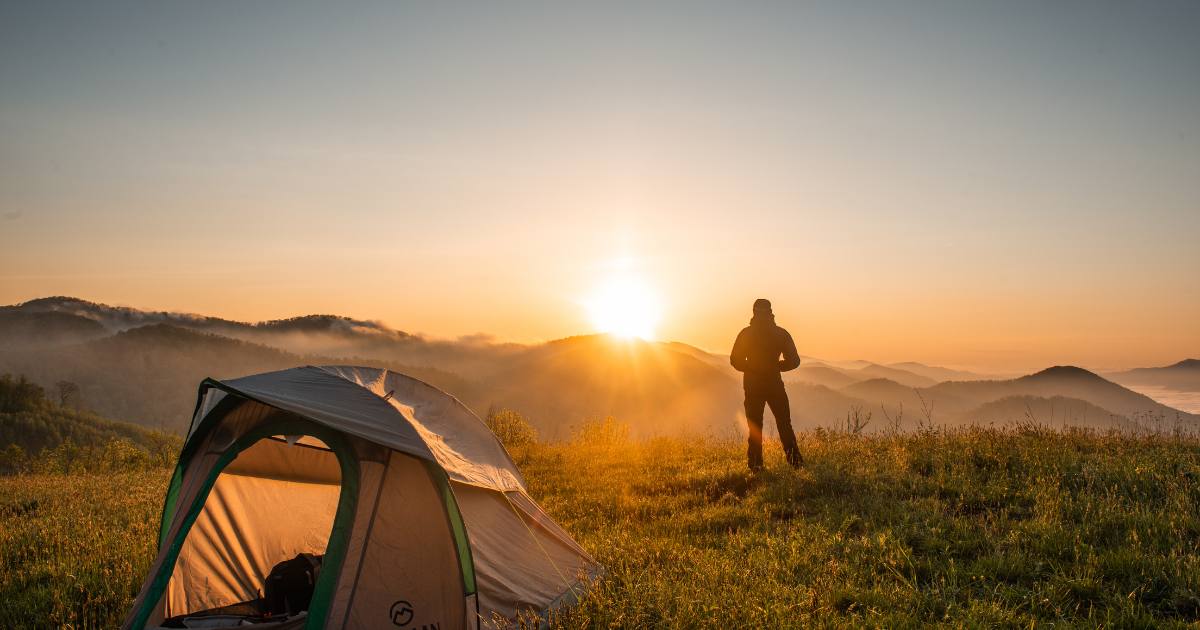 Person on camping trip fueled for adventure by non perishable snacks for traveling