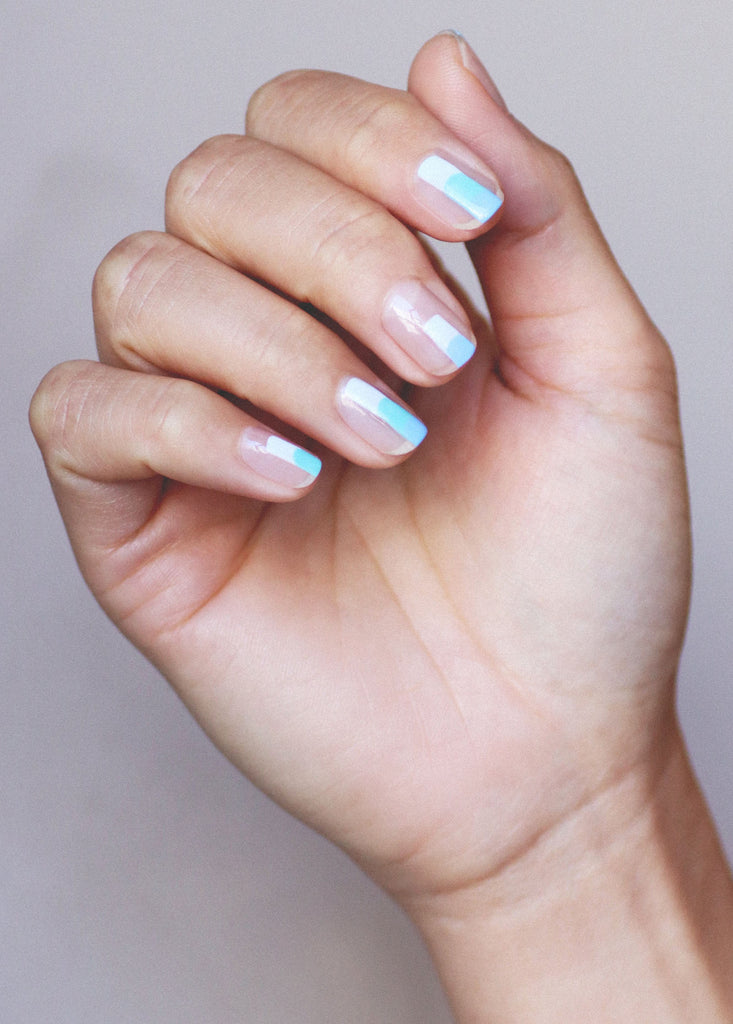 Fair skin hand tone wearing nail polish nail art by Sienna Byron Bay.