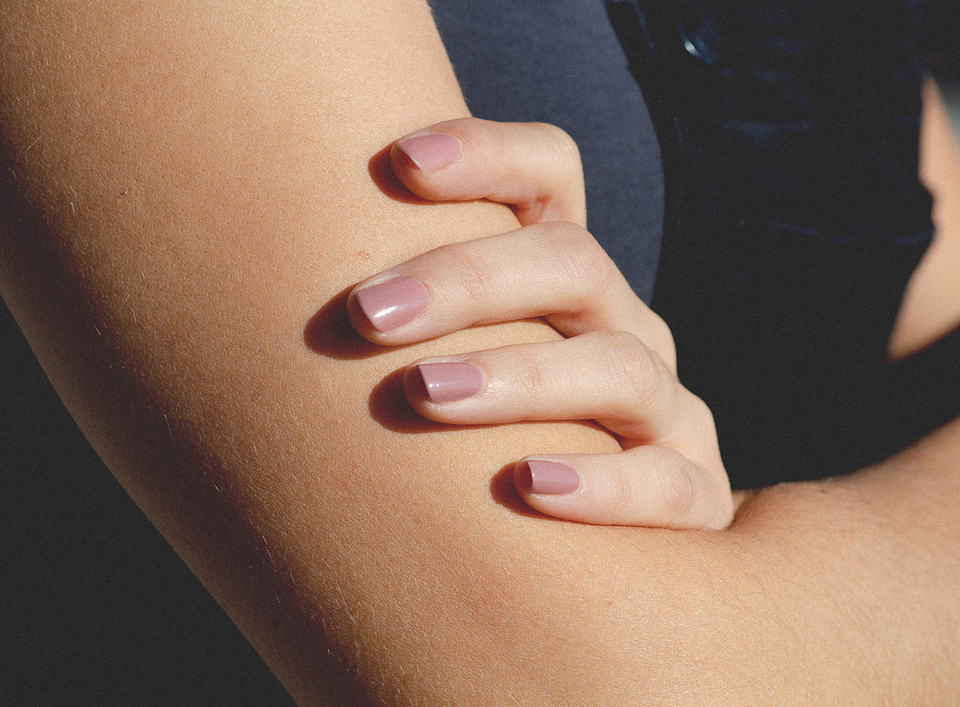 close view of a woman's nails wearing Stony mauve nail polish by sienna