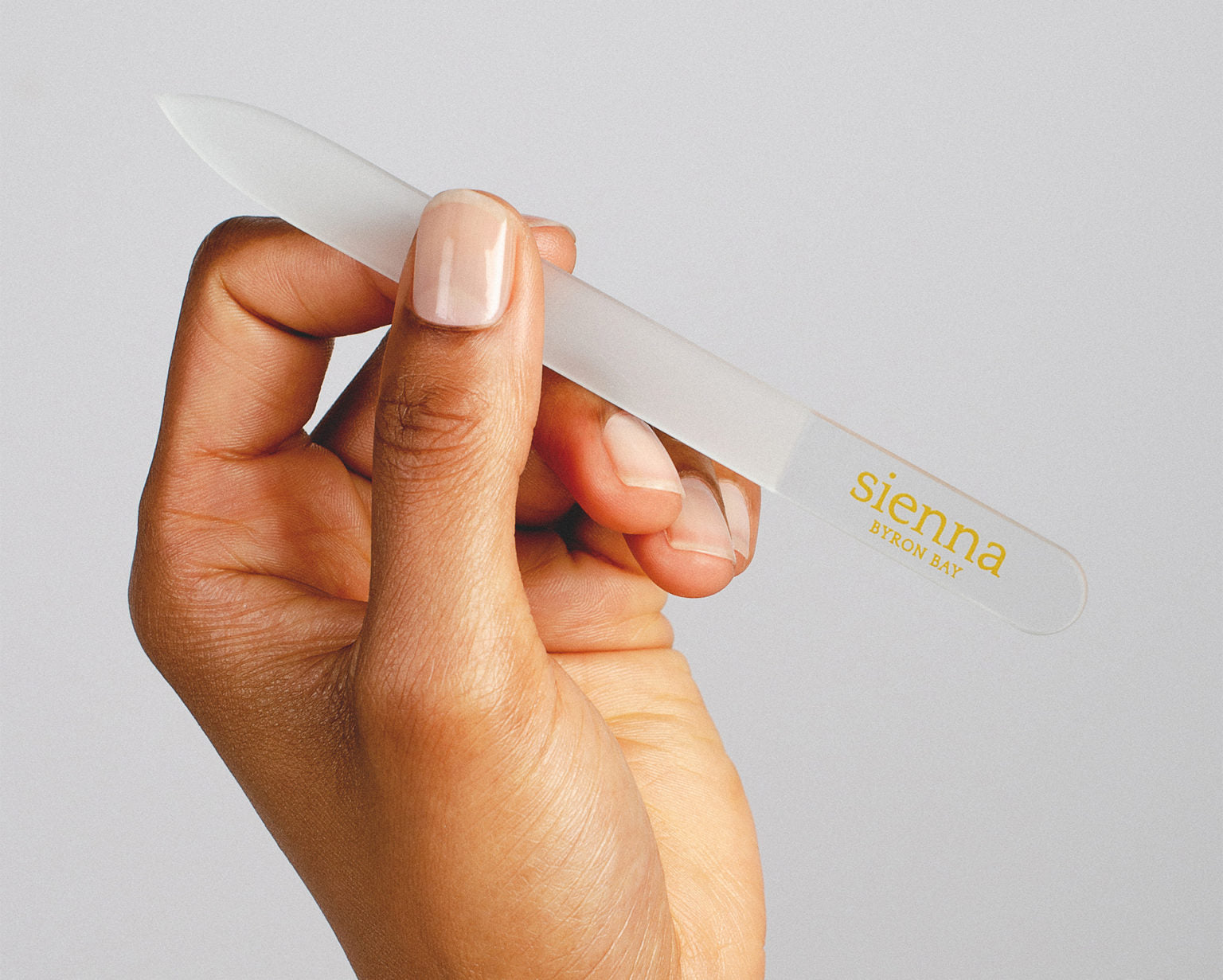 hand holding glass nail file by sienna