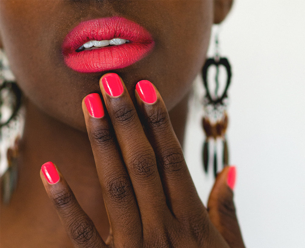 bright pink nail polish on dark skin tone by sienna