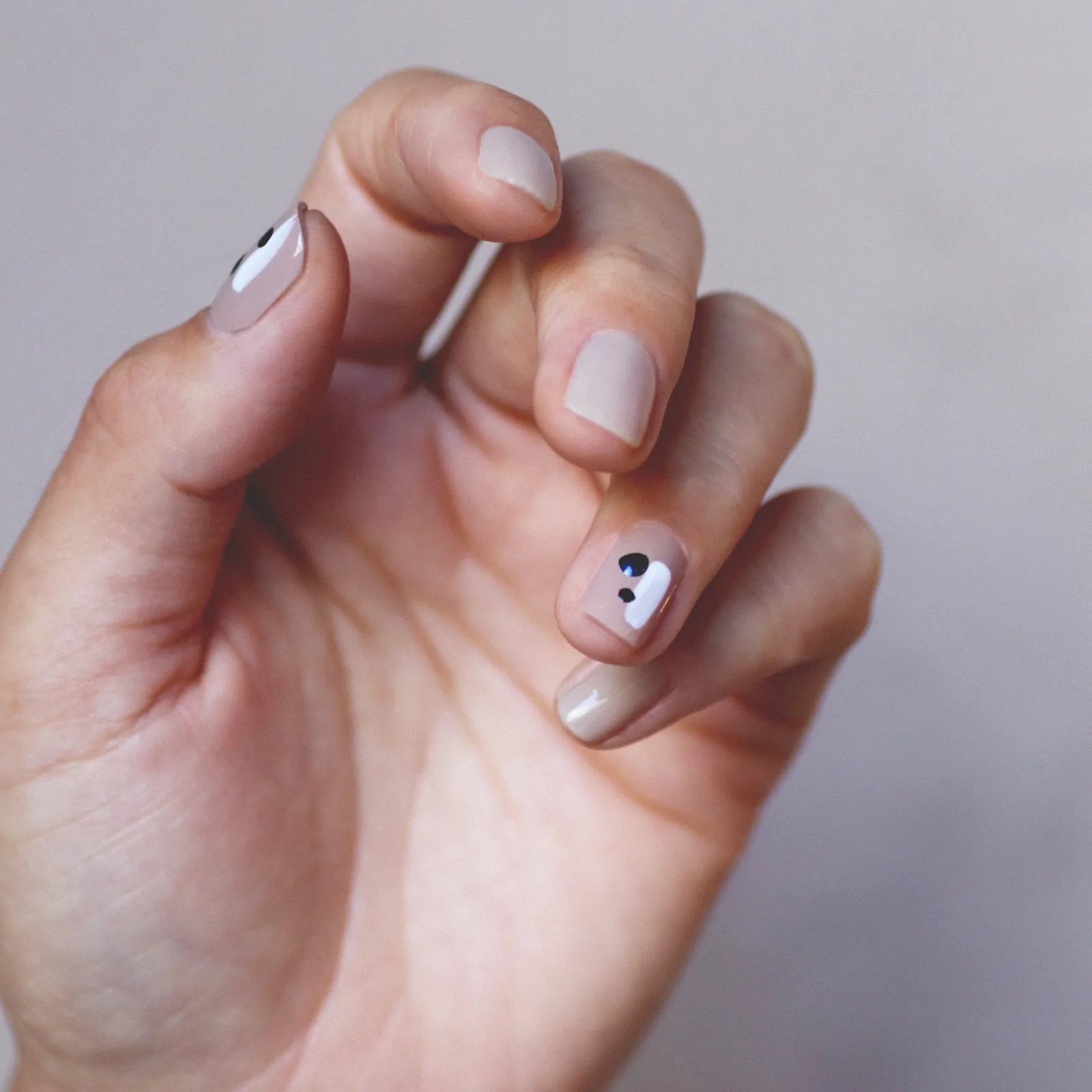Minimalist dots Nail art hand swatch on fair skin tone by Sienna