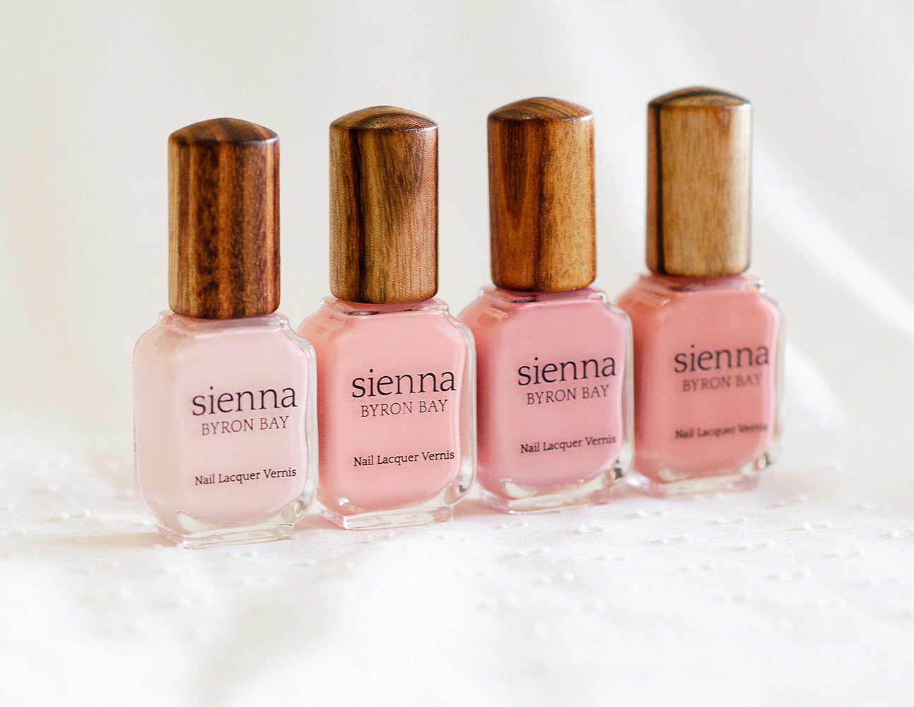 light pink nail polish bottles with timber cap by sienna