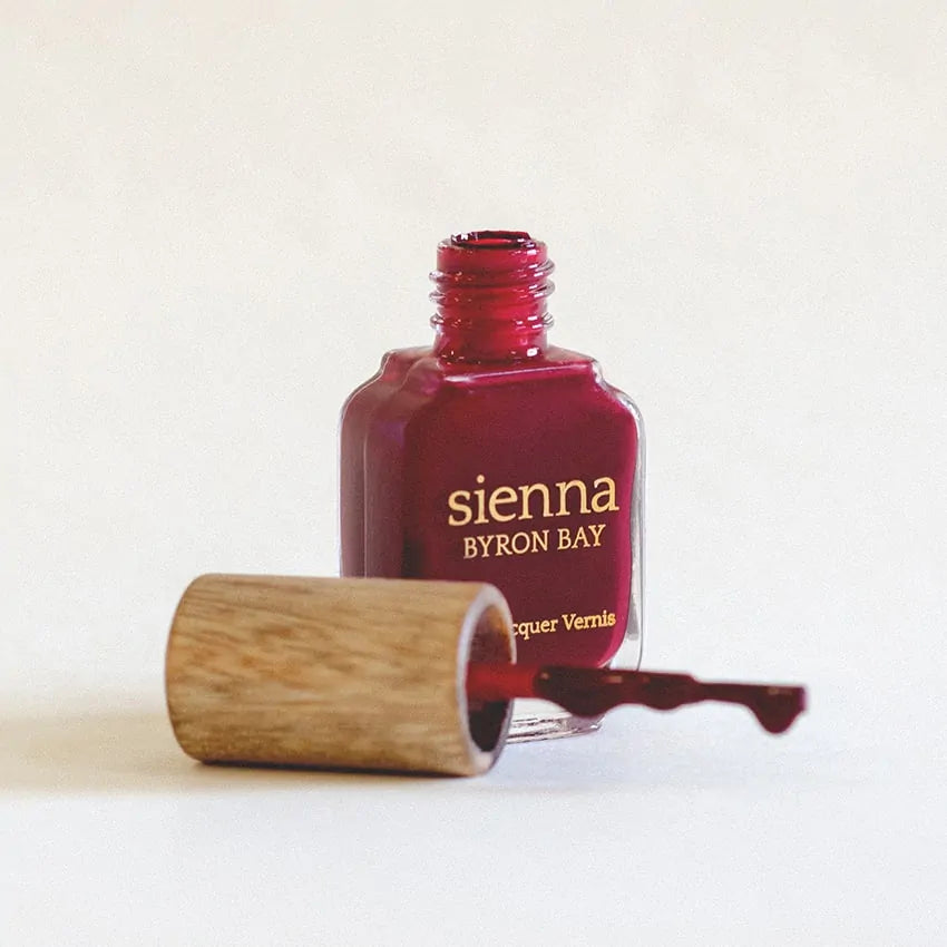 dark red nail polish glass bottle with timber cap by sienna