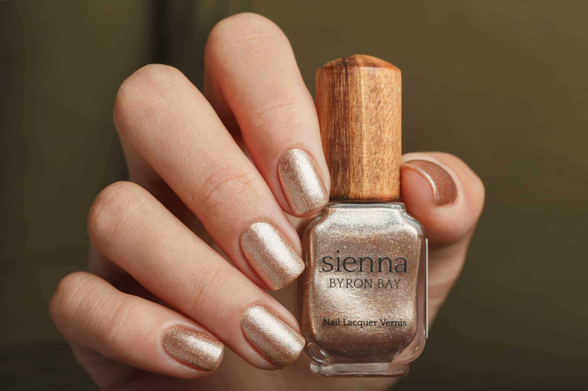 nude pink crystal shimmer Nail polish hand swatch on fair skin tone by Sienna