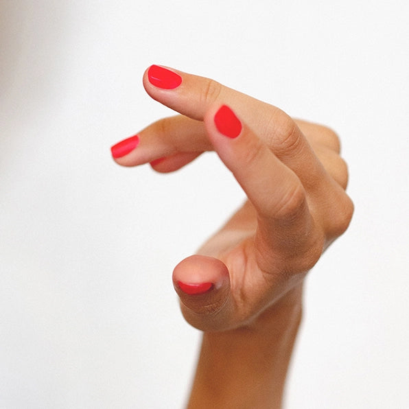 bright barbie pink nail polish hand swatch on olive skin tone by sienna