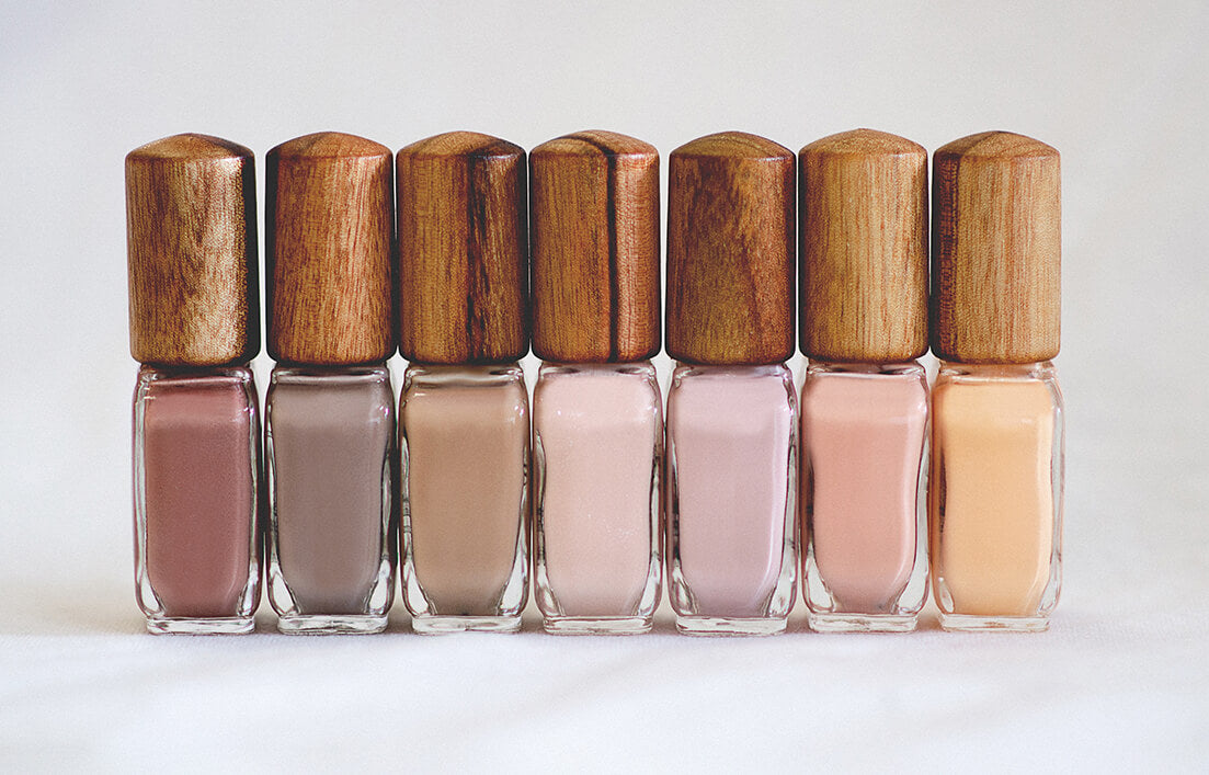 Nude and neutral nail polish glass bottle with timber cap line-up by sienna