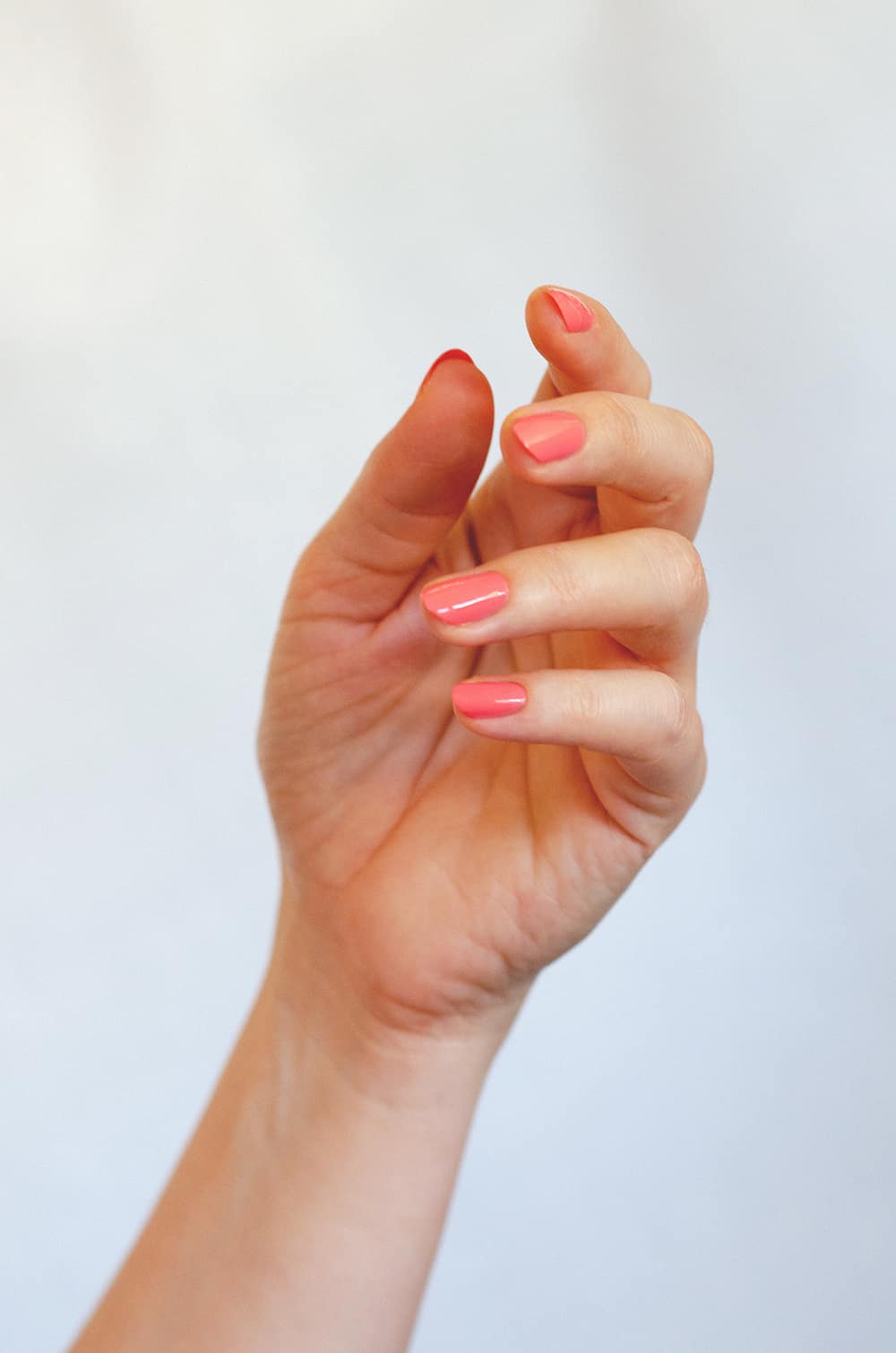 Pink Peach nail polish Hand swatch on fair skin tone by sienna