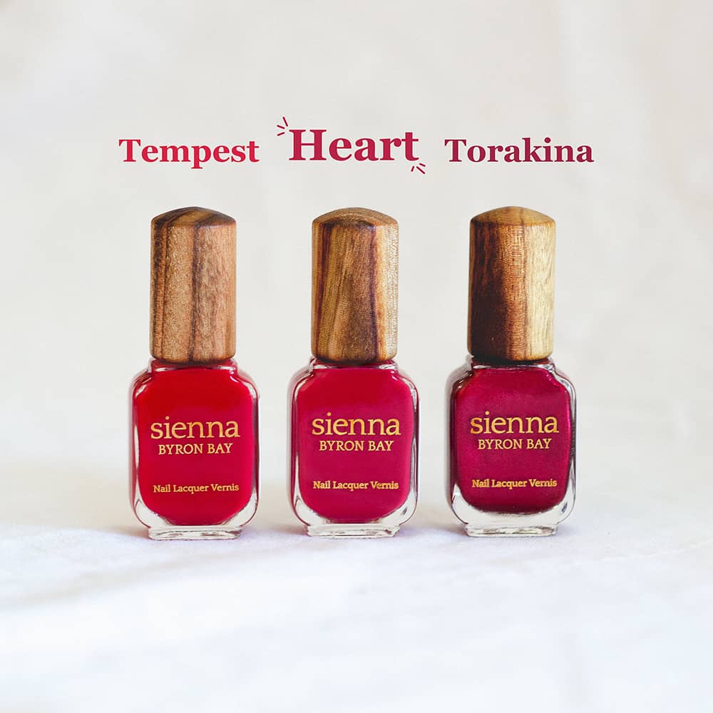 Comparison of classic red Nail Polish bottle with timber cap by Sienna