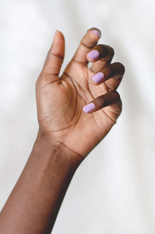 Lavender purple nail polish hand swatch on dark skin tone by sienna