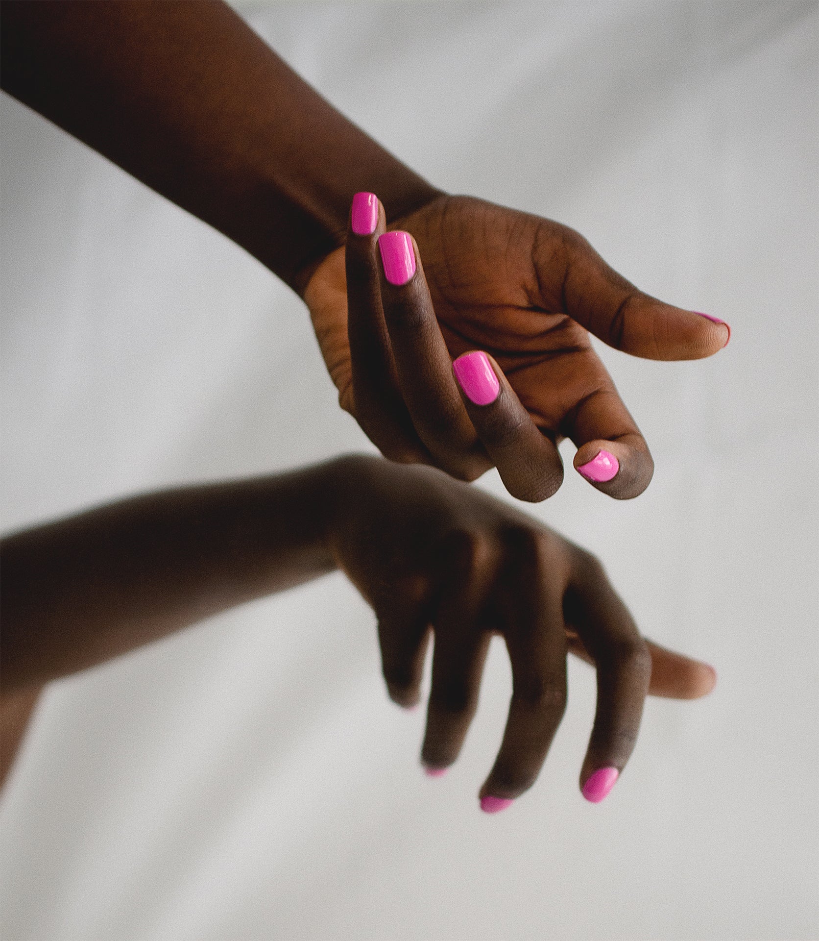 fushia nail polish on dark skin tone by sienna