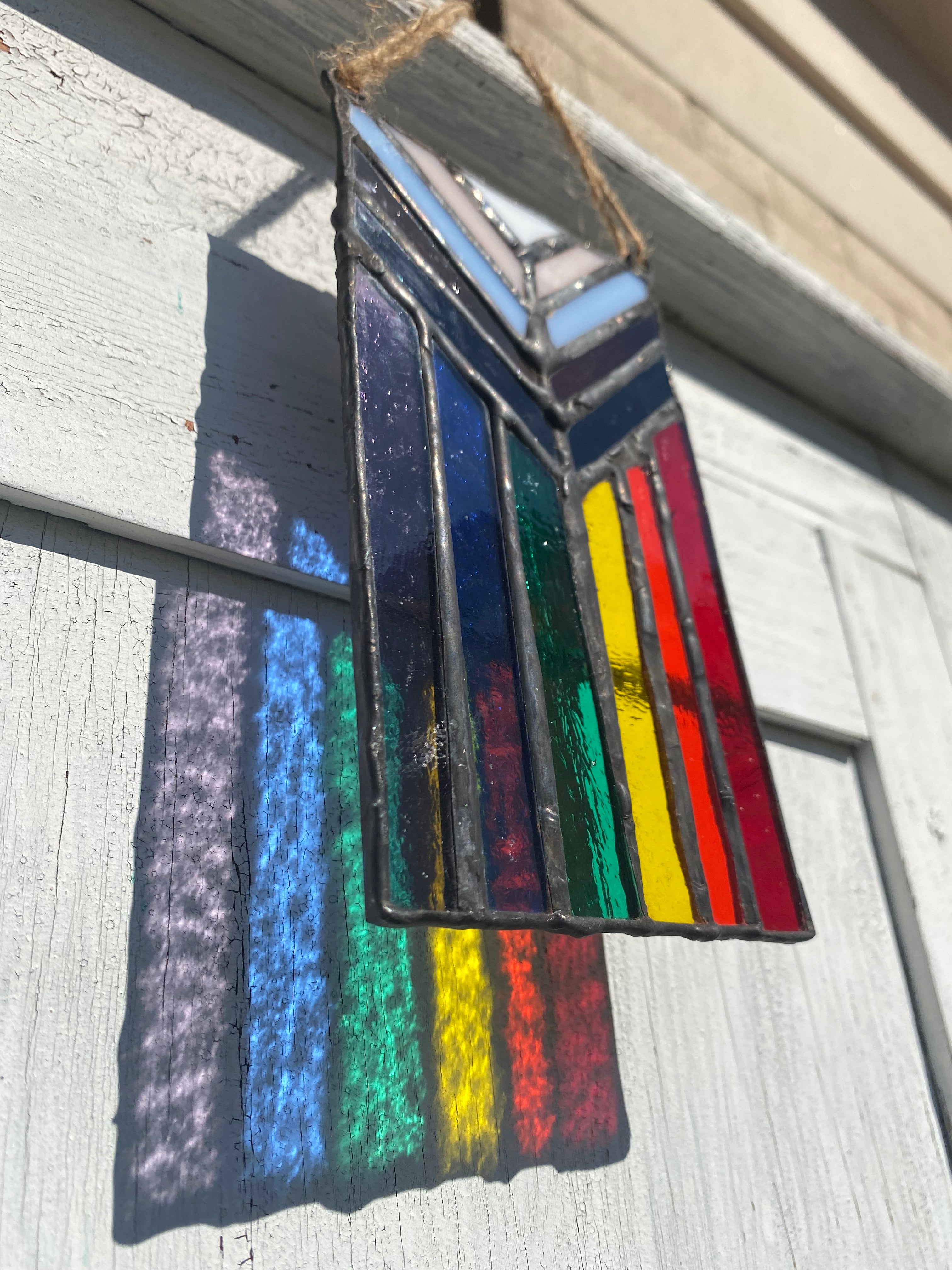 Progressive Pride flag in glass