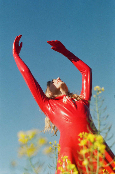 red-latex-arms-blue-sky