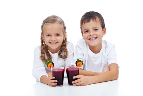 Happy Smiling kids with beet juice