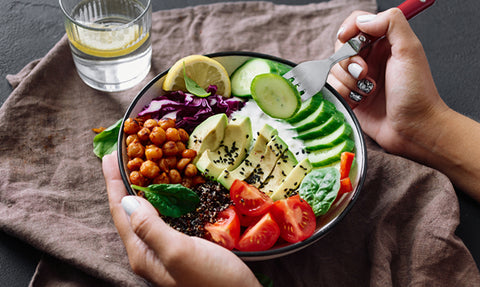 closeup person eating salad